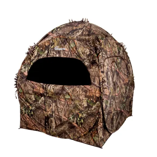 Maskovací stan DOGHOUSE BLIND Maskovací stan pro 2 osoby Ameristep DOGHOUSE Mossy Oak Break-Up Country. 3D krytí ukryje před zraky zvěře. Transportní pouzdro na batoh, kolíky i úvazy. Plocha: 152 x 152 cm, výška: 167 cm.